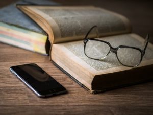 specs and a book