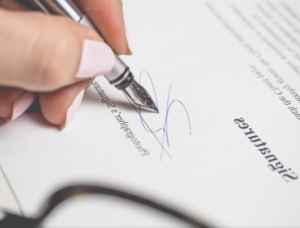 signing a paper